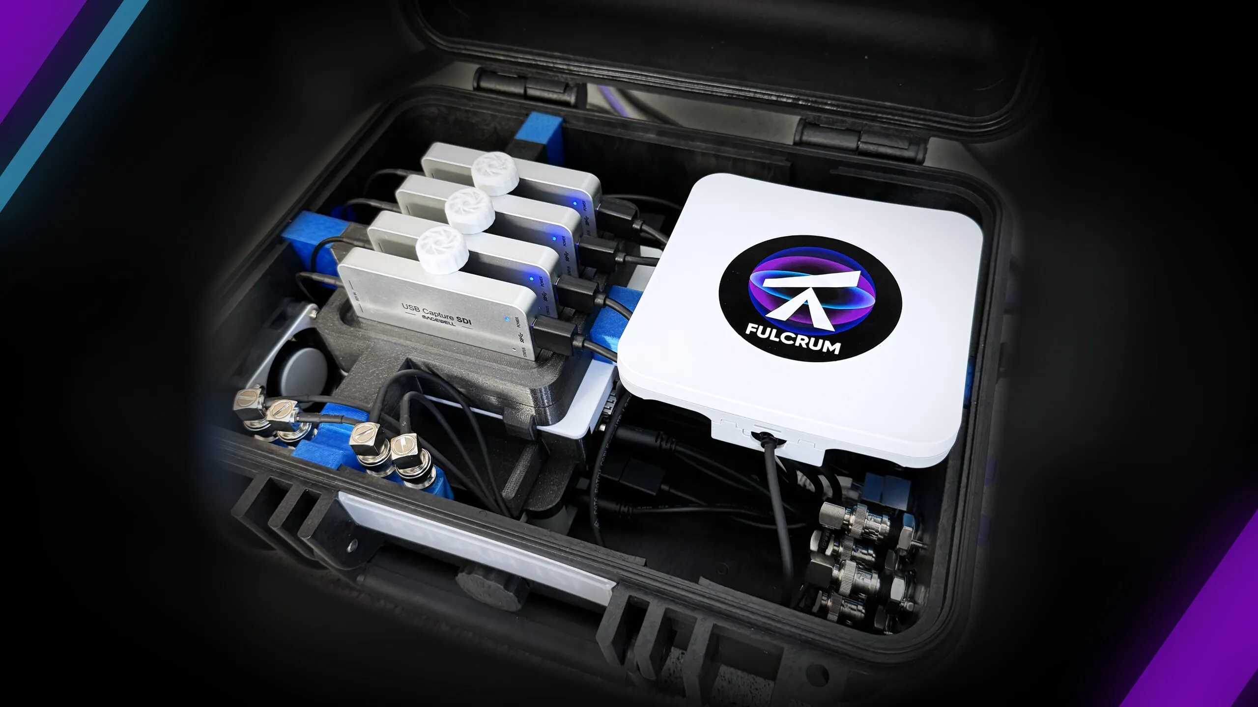 A portable Piston system running in its open case, with four SDI capture units lit, the Piston server, and the camera inputs on the side panel.